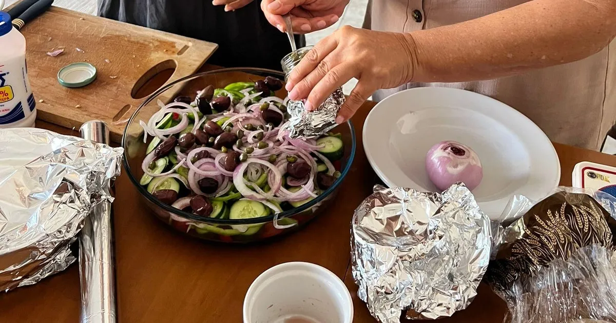 Home kitchen table in Oia at a Greek cooking class with a local grandmother, Santorini Greece